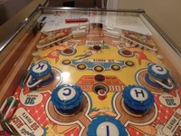 Image # 58320: Slick Chick Playfield - Downfield View 
(This playfield shows the factory-correct placement of the 'one-sided' plastic ball guides on the rubbered posts below each flipper.)