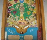 Image # 48760: Sluggin' Champ 'Deluxe' Lower Playfield 
(All plastic parts on this playfield are reproduction, as is the blue tray liner, but we show this image to present the playfield art and cabinet design.)