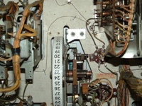 Image # 41063: Smart Set Engineering Sample - Inside Backbox  - Detail 
(Two screw holes in the insert directly above the replay wheel suggest experimentation.)