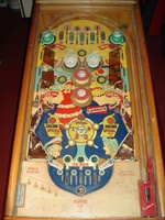 Image # 40594: Southern Belle Sample Game - Playfield 
(The flat light shield plastics on this game are extremely heat-damaged. The upper arch rebound rubber has melted. Serial number 7716.)