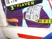 Image # 21319: Spin Wheel BackGlass Detail - Newspaper