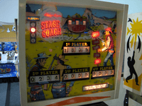 Image # 83567: Stage Coach Illuminated Backglass - Press Gun Smoke Button 
(The backbox has been repainted. Serial number 2031. Photographed at the 2014 Northwest Pinball and Arcade Show.Photographed at the 2014 Northwest Pinball and Arcade Show.)