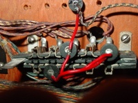Image # 43671: Sunset Manufacturer Design Flaw 
(The manufacturer's placement of the replay plug assembly over a lamp hole prevented a backglass lamp from being installed. Serial number 05530.)