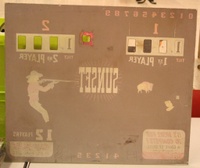 Image # 38317: Sunset Plexiglas Backglass - Reverse 
(A hole was drilled in the replay window of this plastic backglass.)