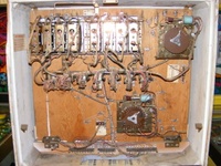 Image # 49835: Super Duo Inside Backbox 
(Just below the Point Score Adjustment tag are some holes where something was once mounted, probably a bell. Serial number 04002.)