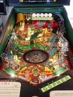 Image # 34242: Tee'd Off Illuminated Playfield 
(The 'tees' that support the five golf balls are missing in this image. This is a regular production game.)