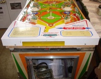 Image # 61867: Big Hit Playfield Edge - Yellow Version 
(This view shows the playfield is composite, not plywood. Serial number 03505.)