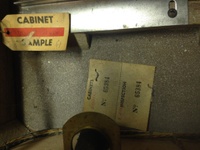 Image # 60024: 3 Jokers Sample Game - Cabinet Serial Number Tags 
(The cabinet is tagged '3 Jokers' with serial number 65384. The Sample motor board is tagged 'Straight Flush' with a handwritten serial number 61.)