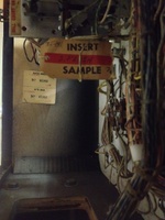 Image # 60020: 3 Jokers Sample Game - Backbox Serial Number Tags 
(The backbox is tagged '3 Jokers' with serial number 65382. The Sample insert is tagged 'Straight Flush' with a two-digit handwritten serial number.)