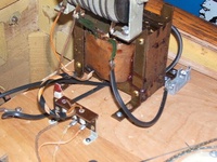 Image # 40712: Trade Winds Rectifier Replacement 
(Genco's selenium rectifier (gray unit on top of transformer, Genco did not put a bridge rectifier in it) in this game failed and so was jumpered out of the circuit and replaced by a new bridge rectifier, using the black wires. Serial number A3958.)