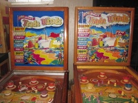 Image # 62869: Trade Winds Backglass Comparison 
(The silver trim around the left playfield is spray paint added by a previous owner.)