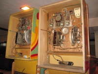 Image # 62882: Trade Winds Inside Backbox Comparison 
(The taller backbox on the right has an after-factory placement of a white chime box and a relay.)