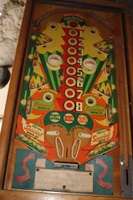 Image # 53492: Tri-Score Playfield 
(The two white posts in center playfield were added after this game left the factory. The two triangular plastics at the bottom of the playfield should be pointing downward. The rebound rubber beneath it is not angled like this plastic..)