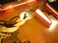 Image # 25716: War Kick-Out Hole 
(This playfield version has two kick-out holes.)