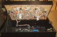 Image # 25719: War Under Playfield 
(This playfield version has two kick-out holes.)