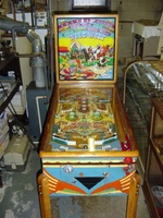 Image # 37536: Wild West Cabinet - Front View 
(The right side of the lower cabinet shows a shift of color from dark blue to light blue. This light blue extends to the cabinet front. The remainder of the cabinet shows dark blue. The owner did not explain the reason for the lighter blue color.)