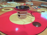Image # 66439: World Fair Cardboard Spacer 
(The factory placed a cardboard ring to fill the space between the playfield and the bottom edge of this plastic bumper.)