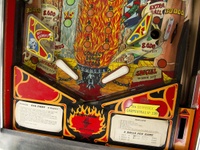 Image # 71596: Evil Fight Lower Playfield 
(The hole from one of two missing star rollover inserts can be seen in this image.)