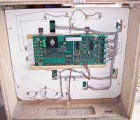Image # 37388: Gun Men Inside Backbox 
(There are two boards shown here and connected to each other with a white ribbon cable.)