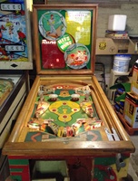 Image # 63524: Hits and Runs Cabinet - Front View 
(The left-side ballplayer figurine is not original to this game. Serial number A1283.)