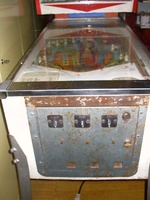 Image # 20826: Blue Ribbon German Front (with larger cabinet) 
(Here, the coin slots are part of the coin door and not in the lockdown bar. A cabinet having more depth was needed to accommodate the larger coin door. This game is serial number 'BN 1255'.)