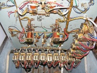 Image # 64254: Miss Universo (3 Ladies) Under Upper Playfield 
(We do not know what used to be attached to the seven clipped wires shown in the upper left corner of this image.)