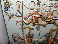 Image # 64256: Miss Universo (3 Ladies) Under Playfield - Detail 
(We do not know what used to be attached to the seven clipped wires shown here.)