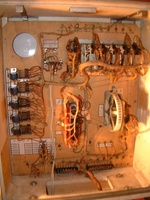 Image # 55869: Supersonic Early Production Inside Backbox 
(The sound card and speaker were removed at some point, revealing a round hole. Nearby is the jack for it, from which an after-factory white cable and wire extends to the lower cabinet to a Gottlieb EM chime unit. The add-a-ball option jack was not installed at the factory. The ball-in-play light bulb sockets were not installed for balls 6 through 10. Serial number 0003.)