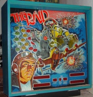 Image # 39675: The Raid Backglass 
(This backglass had been broken in several places and is glued together.)