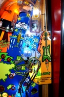 Image # 77454: Al's Garage Band Goes On a World Tour Early Production Playfield - Top Ball Lock VUK 
(Seen here at the end of the horseshoe ramp, this VUK was removed early in production. Serial number not given.)