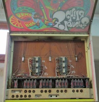 Image # 70609: Flower's Child Backglass in Service Position 
(Three festoon lamps illuminate the backglass.)