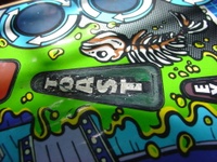 Image # 29716: Junk Yard Prototype Playfield Insert Detail 
(Toast insert is green on this prototype playfield, but white on production games.)