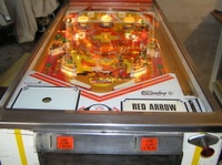 Image # 36537: red Arrow Illuminated Playfield 
(Not all pop bumper caps match the ones on the game in the flyer.)