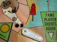 Image # 49889: Cabaret Sample Game - Detail 
(The extra holes near each flipper likely were drilled by an operator to allow longer 3-inch flippers to be installed.)