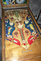 Image # 75418: Canasta Playfield 
(This playfield is missing the two flipper-shaped posts at the very top center of the playfield, above the white post, and where a rubber ring fits around all three of them.)