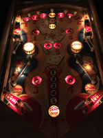 Image # 75423: Canasta Illuminated Playfield 
(This playfield is missing the two flipper-shaped posts at the very top center of the playfield, above the white post, and where a rubber ring fits around all three of them.)