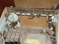 Image # 65436: Grand Slam Inside Cabinet - Front 
(The knocker is located to the left of the chimes in this picture as the part of the chime unit that is closest to the cabinet wall. The left flipper switch and it red wires are shown here detached from the cabinet wall.)