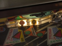 Image # 53941: Brave Team Illuminated Standup Targets 
(The red drop target on the far right is dropped, showing the captive ball rail. Serial number 4128.)