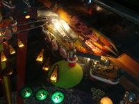 Image # 48813: Fire Action De Luxe Illuminated Playfield - Detail 
(There is a ball inexplicably perched in the right outlane.)