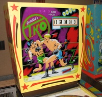 Image # 43139: T.K.O. Backglass 
(This game was photographed at Chicago's Pinball Expo 2009.)
