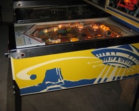 Image # 55543: Close Encounters of the Third Kind Prototype Game - Cabinet - Right 
(This game has no serial number. Notice the blue and yellow backbox stripes on its front.)