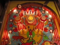 Image # 39527: Circus Illuminated Upper Playfield 
(The orange and red 1000-point bumper caps are reversed on this game as compared to the flyer. Serial number 1841.)