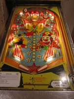 Image # 39526: Circus Illuminated Playfield 
(The orange and red 1000-point bumper caps are reversed on this game as compared to the flyer. Serial number 1841.)