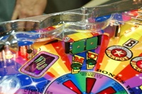 Image # 36252: Wheel Of Fortune Early Production on Assembly Line 
(Images 36235 through 36269 show one of the first ten or so games being assembled at the factory. Some playfield parts may have not yet been installed on this playfield.)