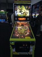 Image # 37808: Shrek� Sample Game - Illuminated Front View 
(Backbox topper reads 'preliminary graphics and game rules'. Serial number E 216298.)