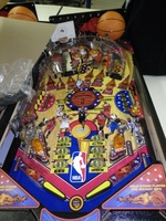 Image # 47040: NBA Playfield - Chinese Export 
(These export games have no center spinning disc, no aerial habitrail, the MVP targets are not drop targets, the STAR targets are square instead of round, and the slingshot flasher caps are orange instead of red.)