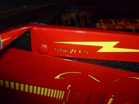Image # 52374: AC/DC (Let There Be Rock Limited Edition) Cabinet Trim - Detail 
(The initials of the designer and programmer are evident here. Serial number 234387.)