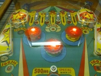 Image # 56435: Cue Ball Upper Playfield 
(The two white targets and the green and yellow pop bumper platters are not original to this game.)