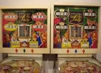 Image # 34723: Dancing Lady Sample and Production Backboxes 
(Besides having multiple colors around the score reels, the Sample backglass and backbox were slightly shorter than the production version. Most of the artwork appears to have been redrawn in the production glass.)