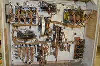 Image # 61049: Discotek Inside German Backbox 
(The bell has been removed from the upper left corner of this backbox, leaving the solenoid in the mounting bracket. Serial number DK 1092.)